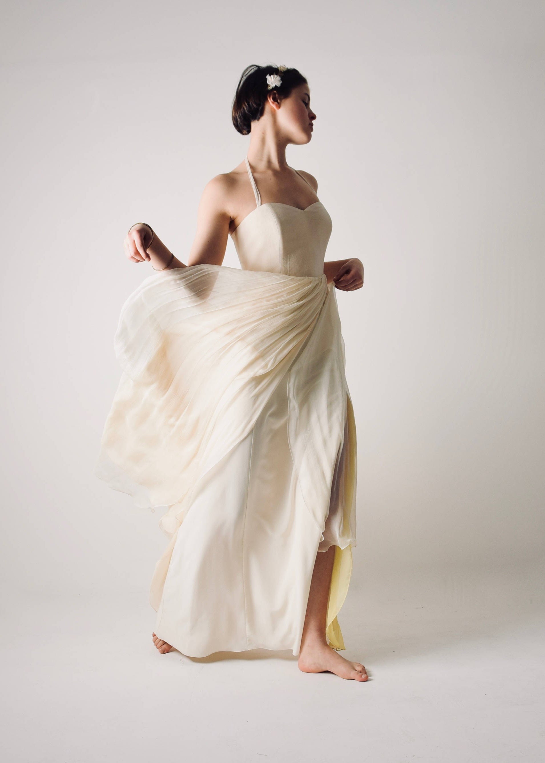 NARCISSUS, an Ivory and Yellow Open Back Wedding Dress in movement