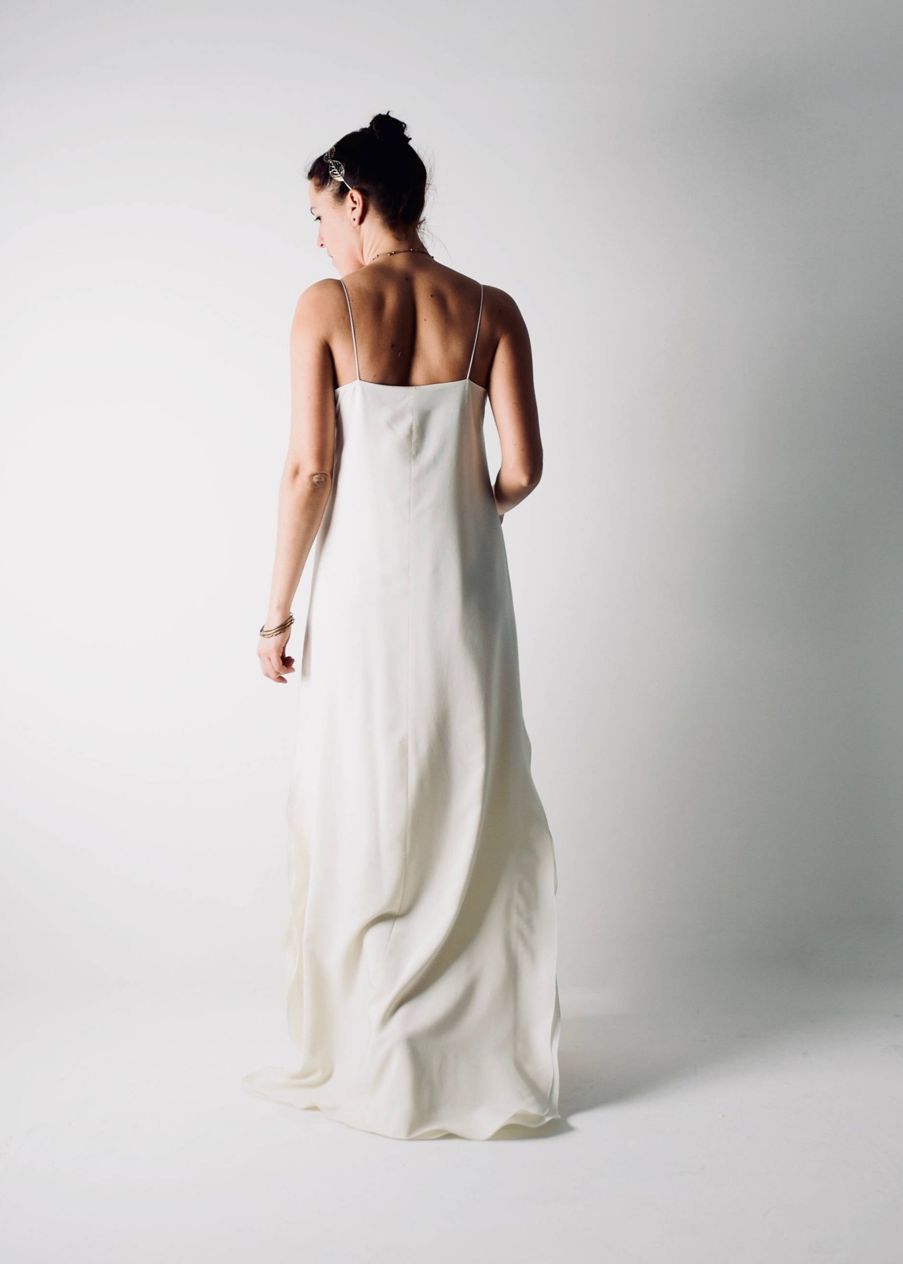 SAPONARIA, a Simple Slip Wedding Dress, with side slits and spaghetti straps, back view