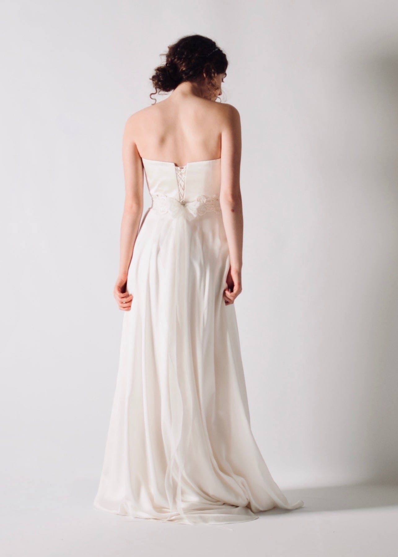 Daffodil, a floral lace bridal sash that closes with a soft silk bow in the back