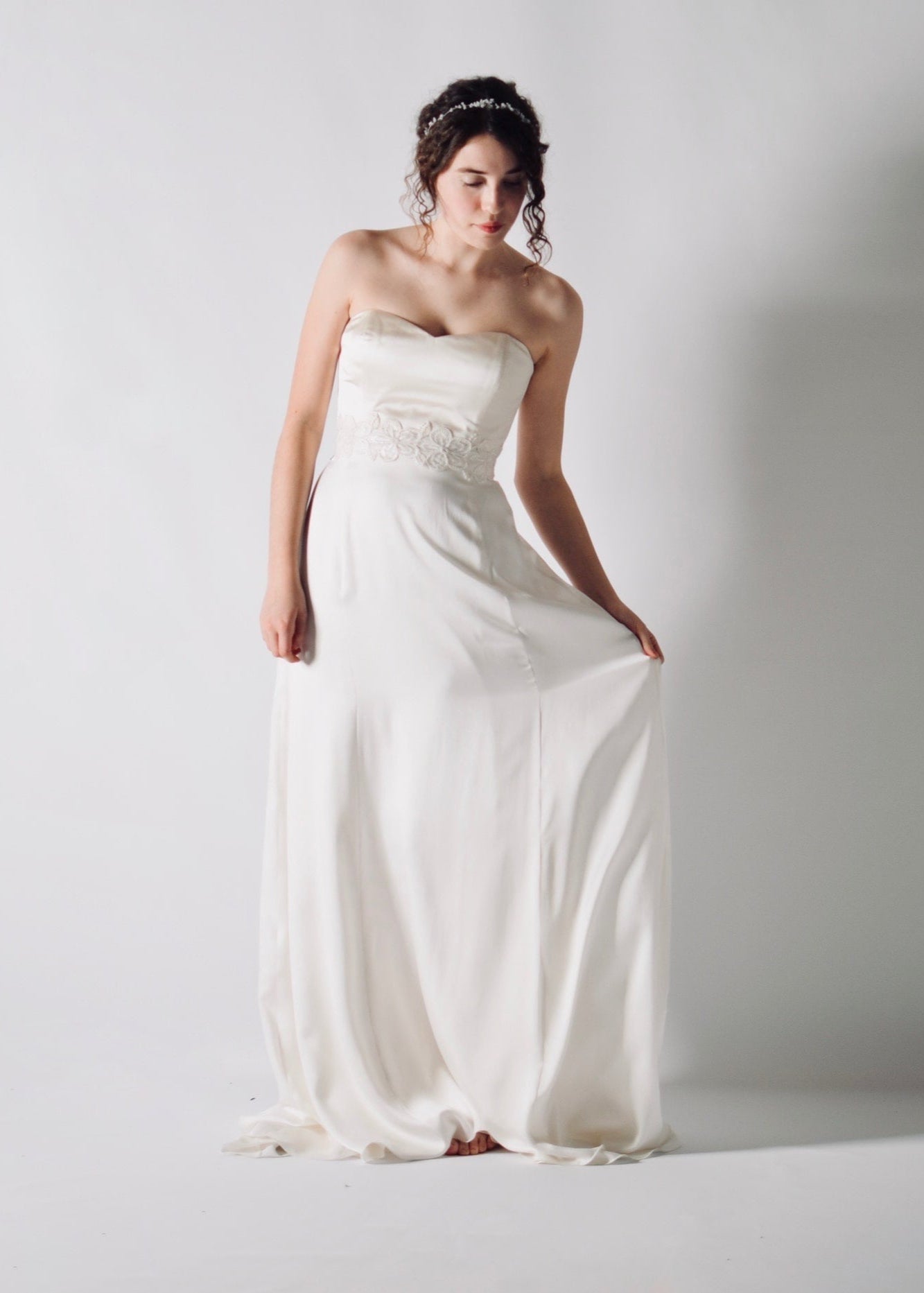 Daffodil, a floral lace bridal sash that closes with a soft silk bow in the back