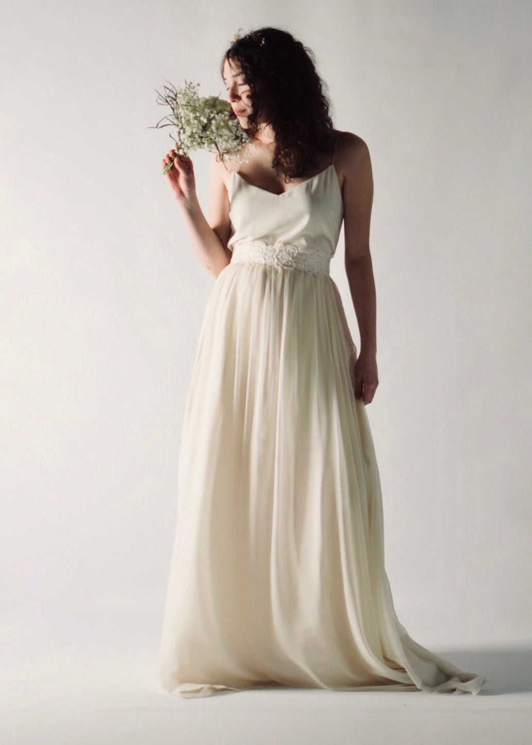 Daffodil, a floral lace bridal sash that closes with a soft silk bow in the back