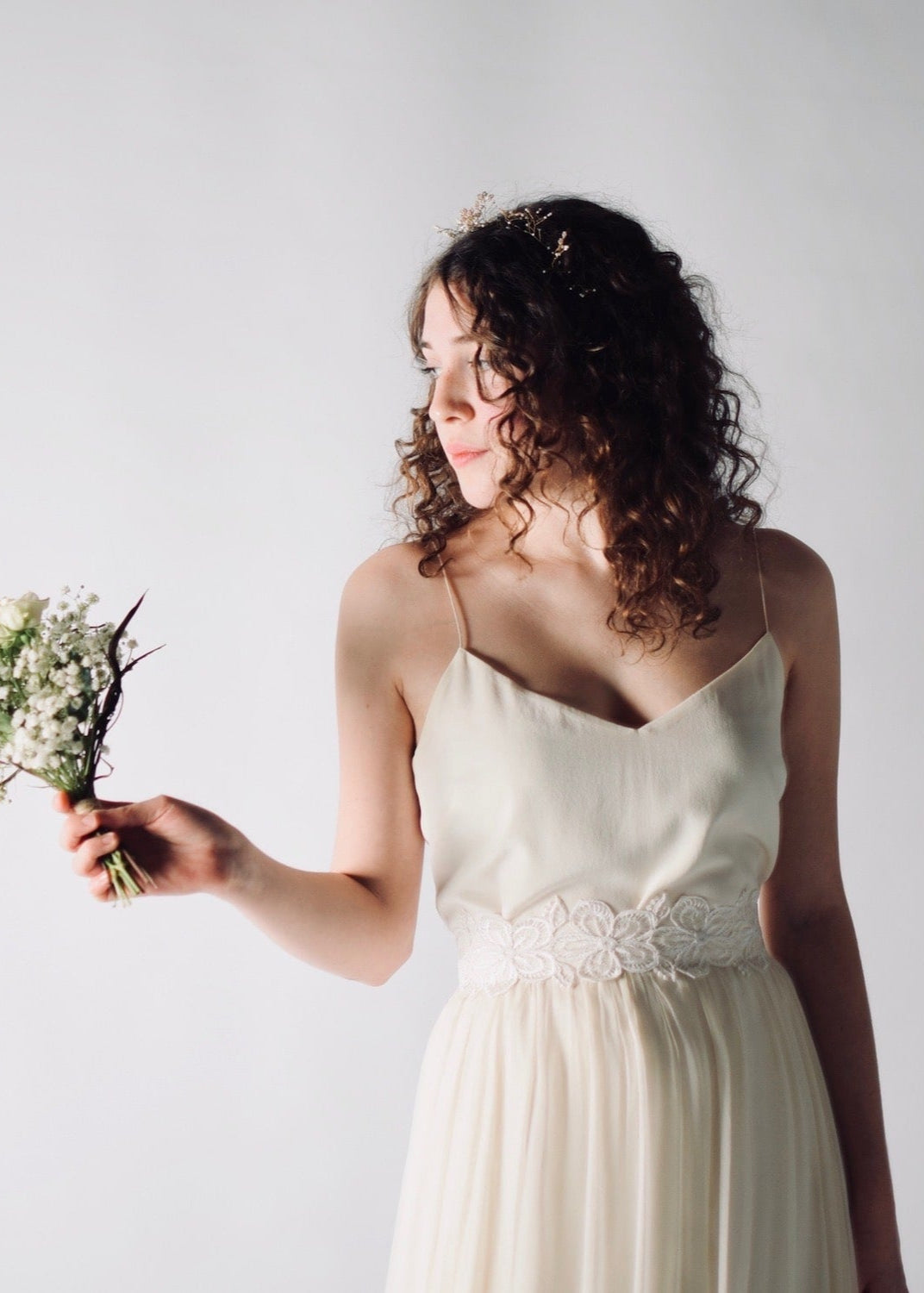 Daffodil, a floral lace bridal sash that closes with a soft silk bow in the back