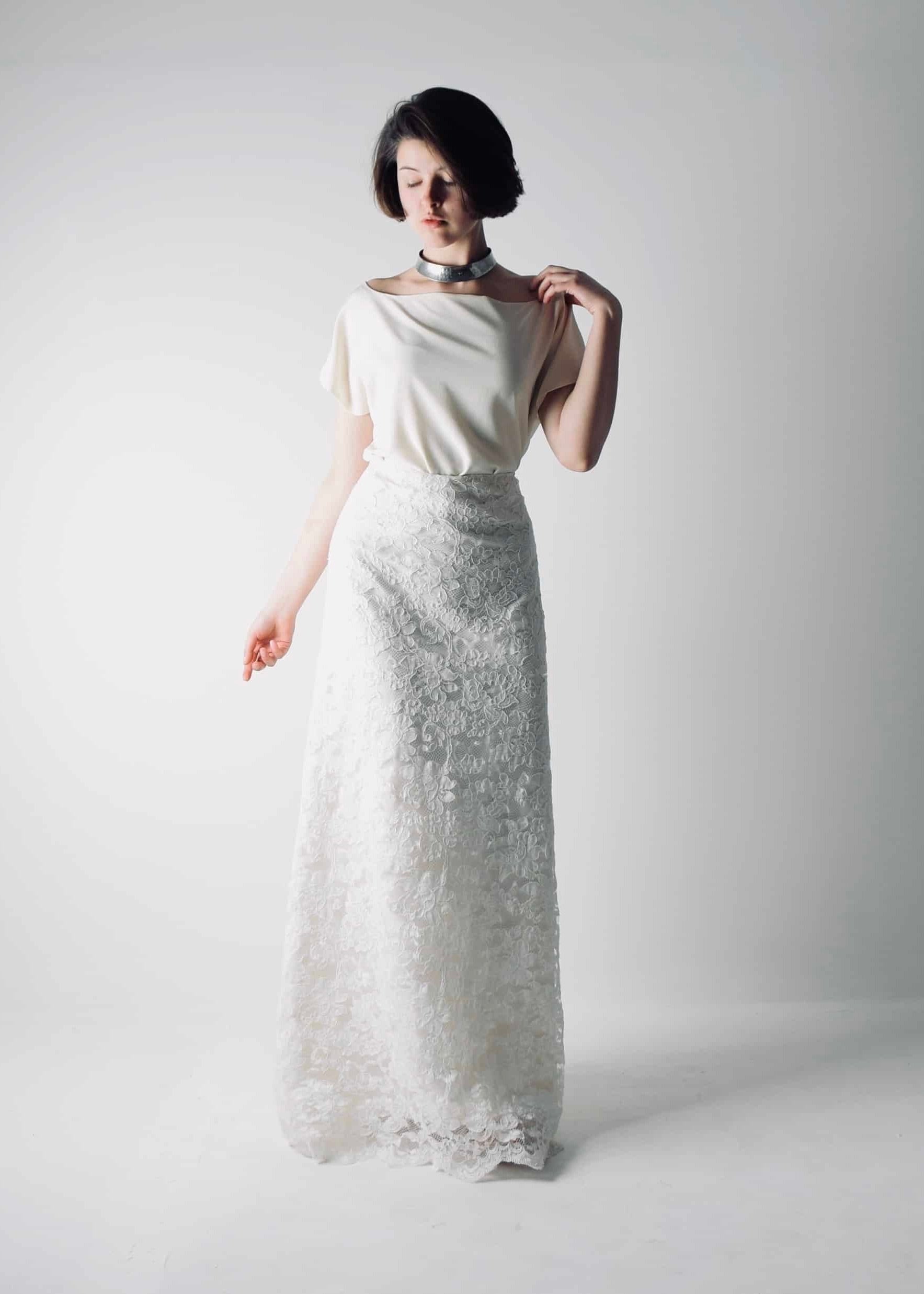 Romantic lace wedding skirt, with an A-line cut, paired with a separate soft silk bridal blouse, for a simple wedding dress look - front view