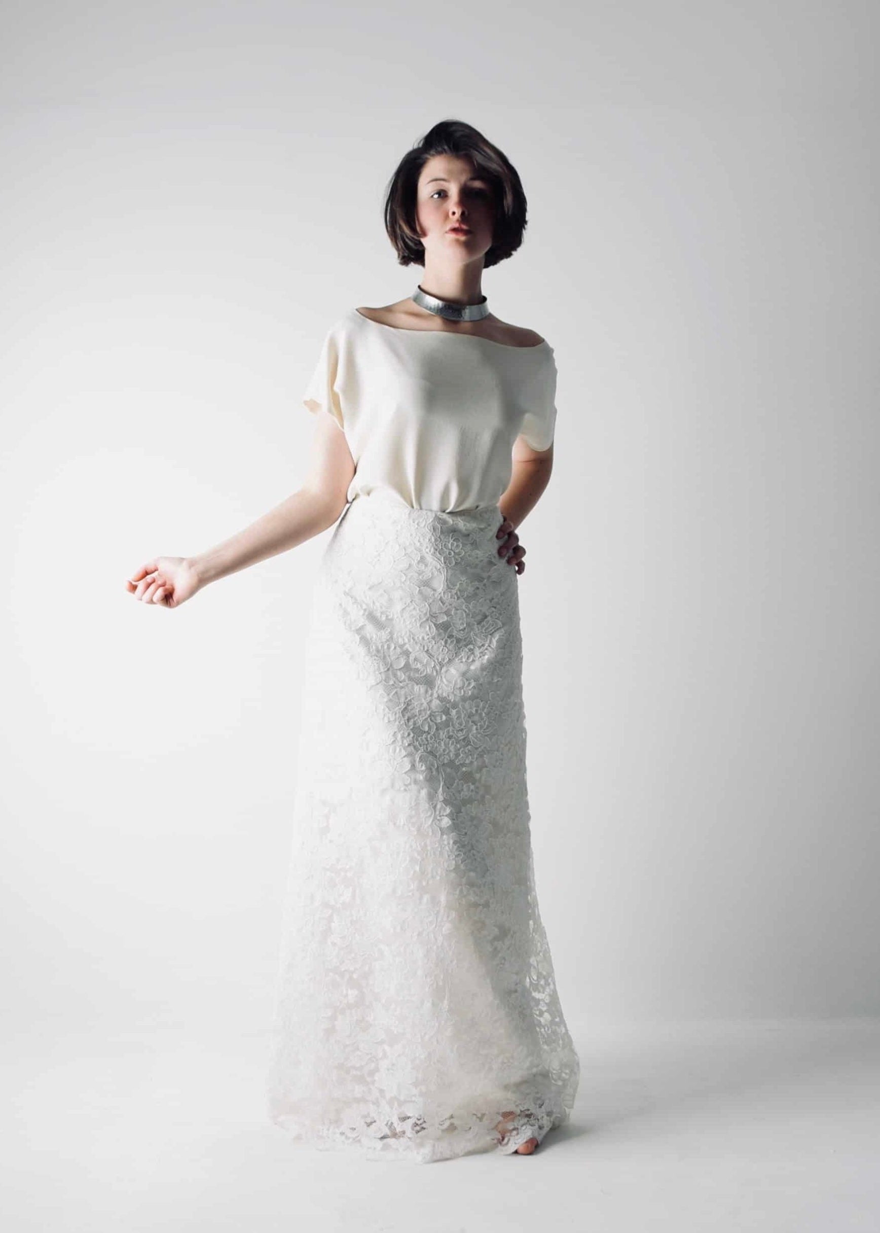 Romantic lace wedding skirt, with an A-line cut, paired with a separate soft silk bridal blouse, for a simple wedding dress look - front view