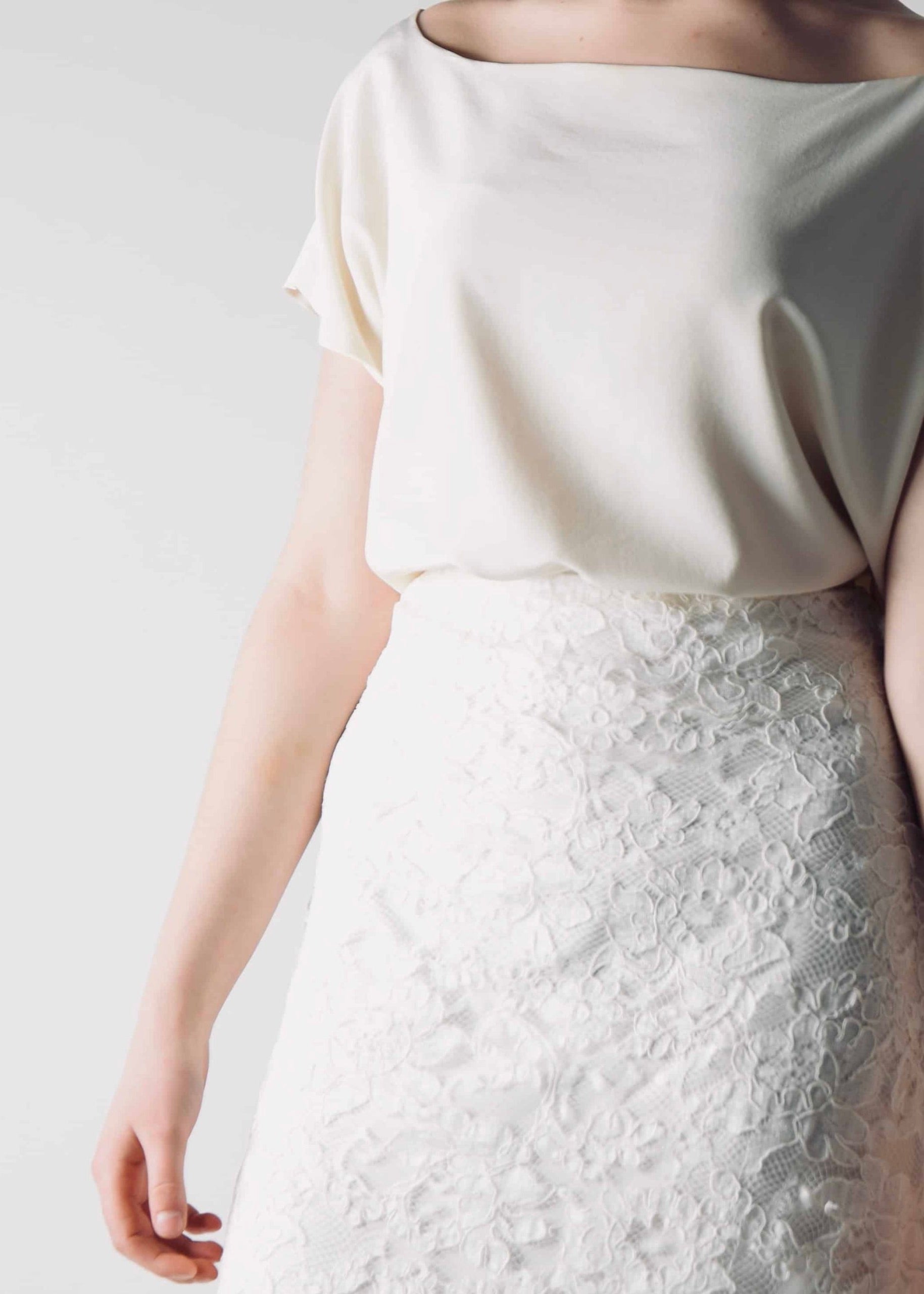 Romantic lace wedding skirt, with an A-line cut, paired with a separate soft silk bridal blouse, for a simple wedding dress look - detail